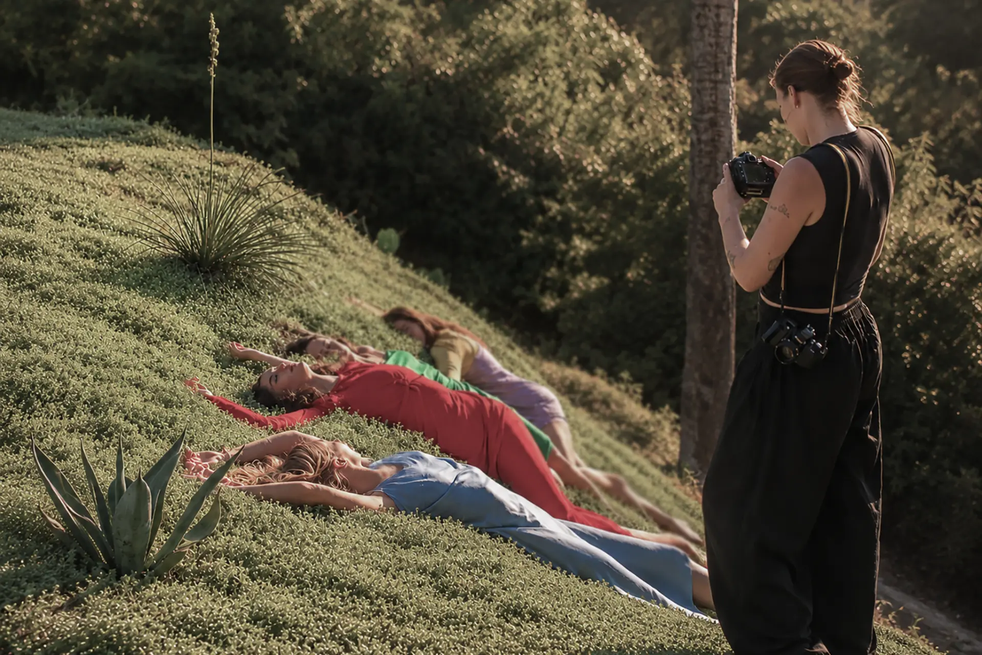 A photographer working with models on the planted hillside at The Observatory